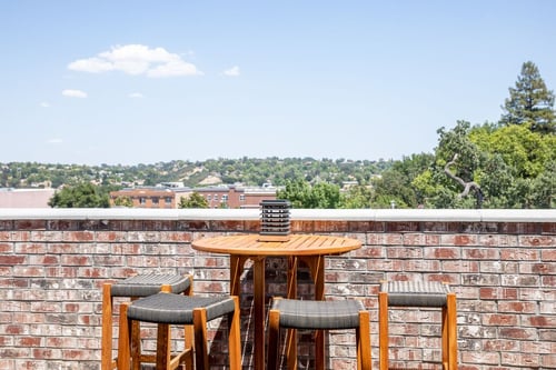 Rooftop dining table with panoramic views of Paso Robles at Tetto Rooftop Bar.