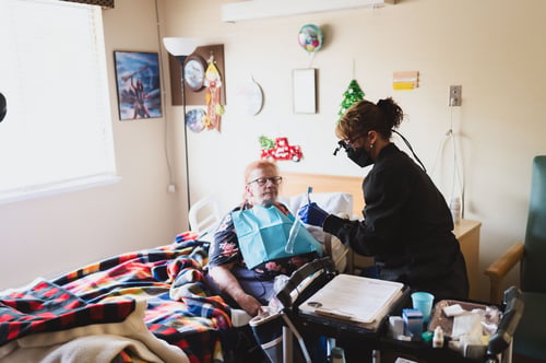 mobile dentist working with patient