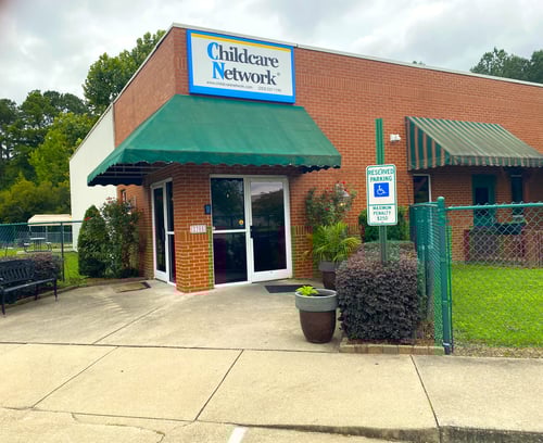 Front view of the school building with a welcoming entrance, designed to create a safe and friendly environment for children and families.