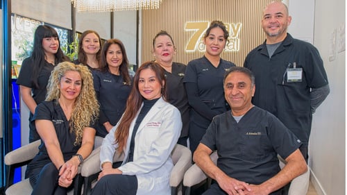 7 Day Dental team members posing inside the Laguna Woods dental office