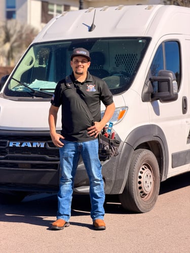 nathan ball in frotn of work van for ball brothers plumbing & ac