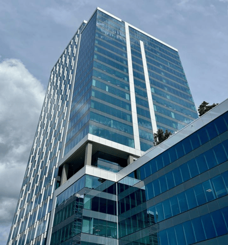 Bottom-up view of an angular office building.