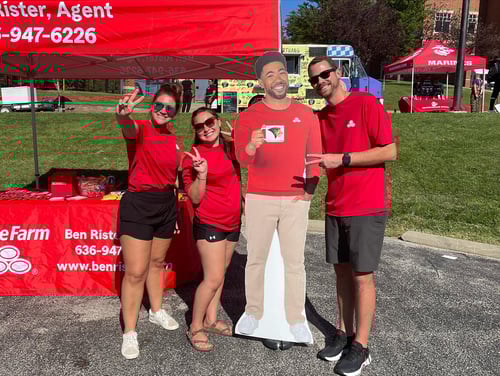 Agent Ben and two team members standing and smiling with Jake from State Farm at local event