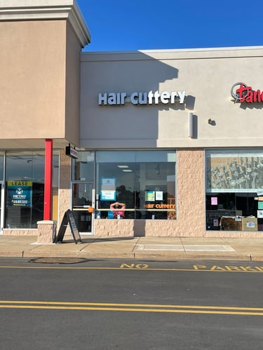 The front entrance of Hair Cuttery at Boulevard Plaza Shopping Center.