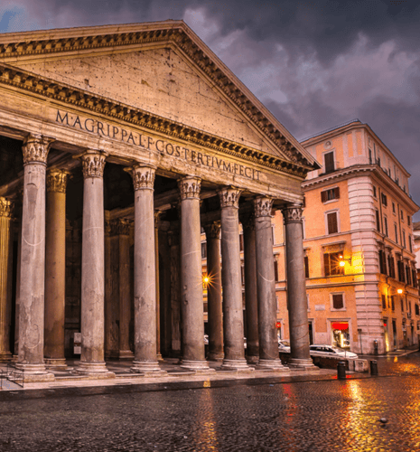 Outside the Pantheon in Rome, Italy during nighttime.