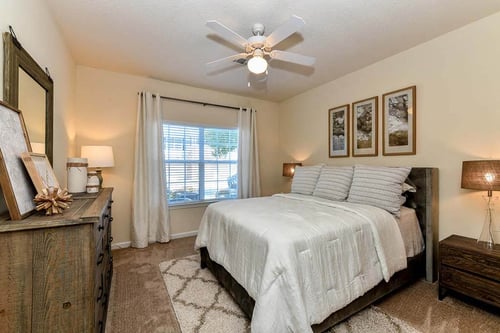 Spacious Bedroom with Large Walk-In Closets & Ceiling Fans at Legends at Charleston Park Apartments, North Charleston, SC, 29420
