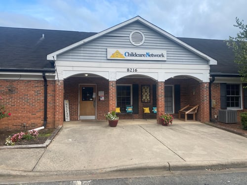 Front view of the school building with a welcoming entrance, designed to create a safe and friendly environment for children and families.