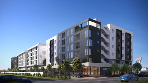 A white and grey building with 6 stories and a clear blue sky at Tellus on Carson Apartments, Torrance, CA, 90502