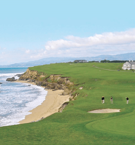 People golfing by the water