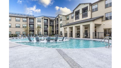Building with pool exterior view at The Bridge at McKinney in Texas