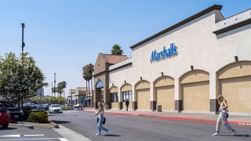 Two blonde woman walking from Marshalls