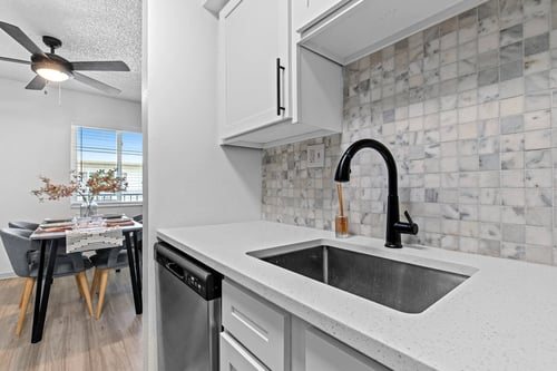 Apartment Kitchen & Dining Table at Postmark at Littleton in Littleton, CO 80120