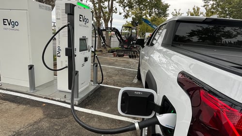 EV truck plugged into EVgo EV charger. Multiple EV Chargers supporting CCS and NACS at the pictured station
