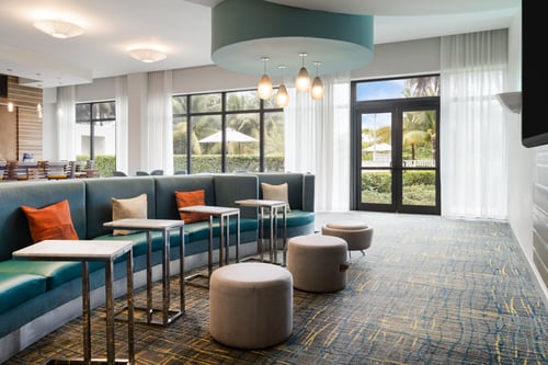 Relax and recharge in our comfy lobby seating.