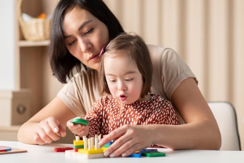 Mother holding hands with her special needs child during a supportive family moment, representing compassionate legal guidance for special needs family law cases in Houston, Texas