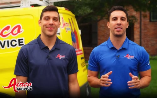 Owners of Airco Service in front of Airco Truck