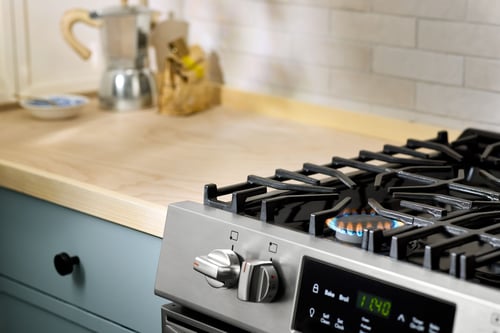A propane stove, powered on
