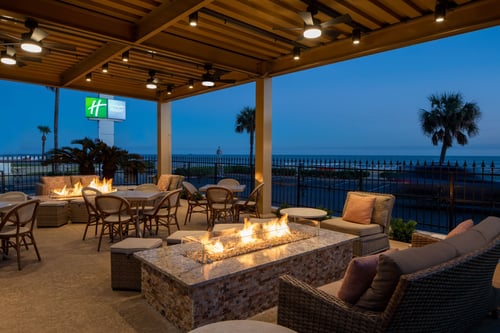 Cozy up by a fire at the Holiday Inn Galveston-On The Beach.