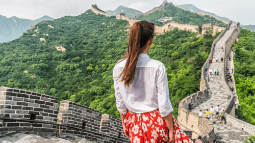 someone overlooking the Great Wall of China