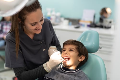 Child smiling during their dental visit.