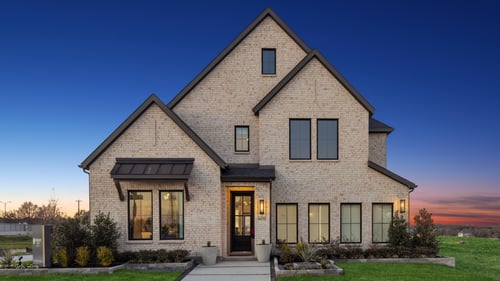 Exterior of the Normandy Homes model at Painted Tree Woodland West in McKinney, TX.