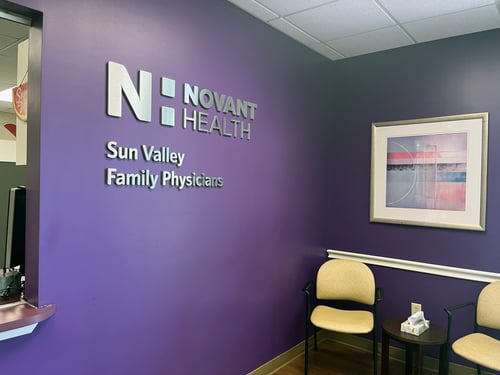 Novant Health Sun Valley Family Physicians lobby with purple walls and seating.