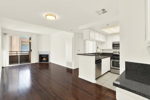 Open Living Room with Fireplace at Peach Tree Court Apartments in Los Angeles, CA 90024