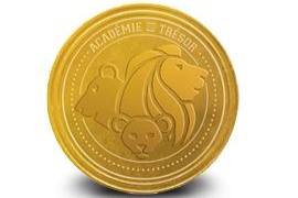 Gold commemorative coin with lion profile and text 'Académie - Trésor' representing Treasure Academy Foundation