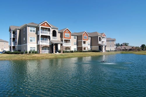 Property exterior with lake view at Ansley Walk in Lafayette, LA 70503