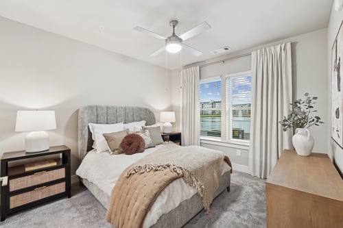 A bedroom with a large bed and a ceiling fan at The Beacon at 331 Apartments, Santa Rosa Beach