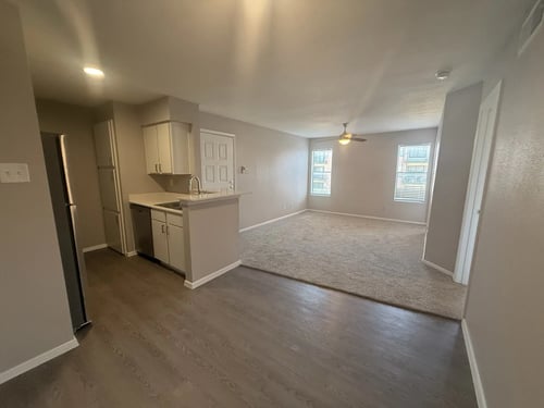 Kitchen and living room area at Brook Meadow Village in Austin, TX 78758