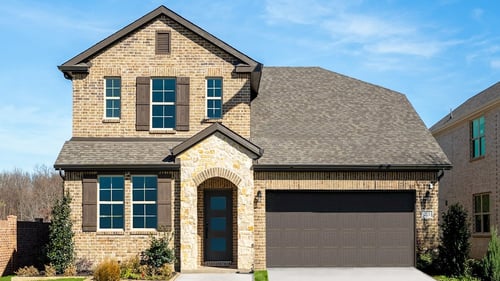 stone family home exterior with garage and covered entry
