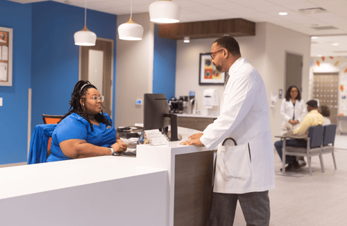 Dr. Carter and the Five Points West primary care team for seniors in the ArchWell Health lobby.