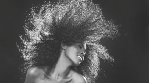 black and white photo of a woman with long hair