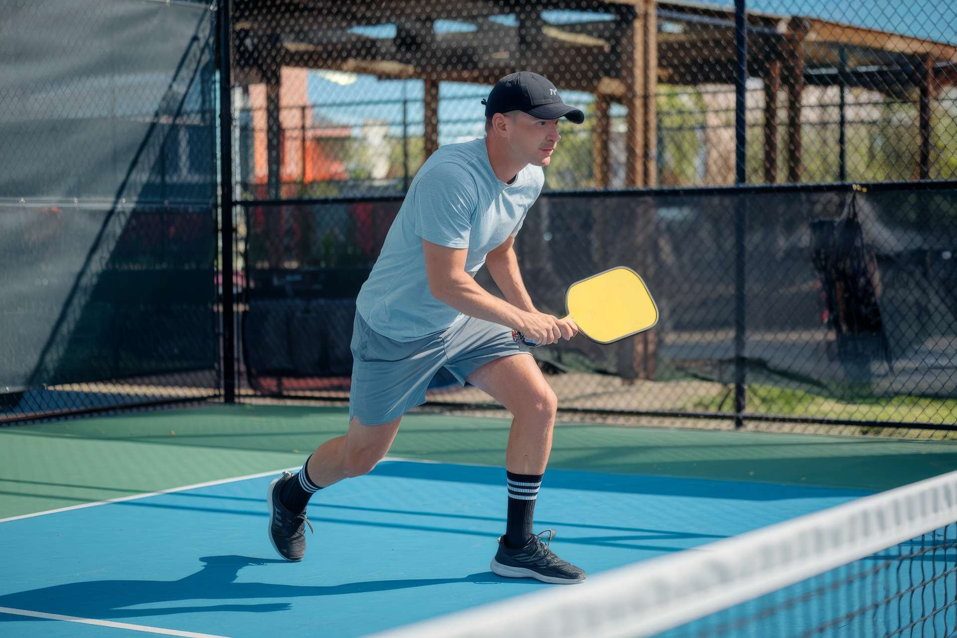 Person playing pickle ball to stay active