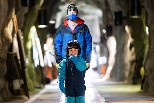 Dad and kid in Peruvian Tunnel at Snowbird