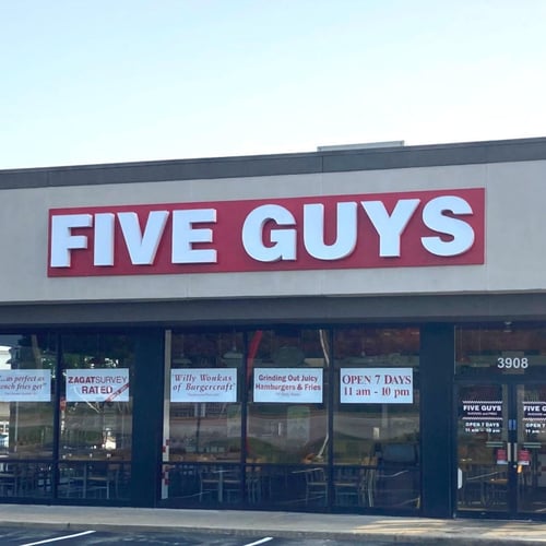 Exterior photograph of the entrance to the Five Guys restaurant at 3908 Grandview Drive in Simpsonville South Carolina.