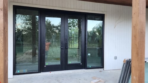 Custom front door and glass installed at a home