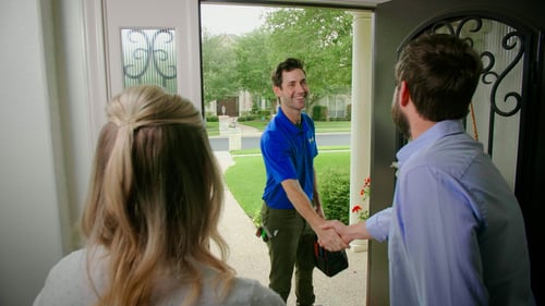 bluefrog plumber greeting homeowner