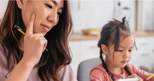 mother thinking sitting next to young daughter