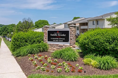 Entrance sign at The Apartments at Saddle Brooke in Cockeysville, MD