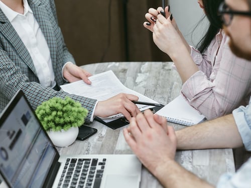 A couple meeting with an advisor.