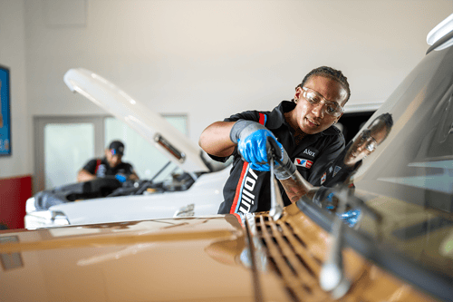 Valvoline technician replaces wiper blades on guest's truck during their visit to Valvoline.