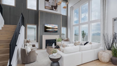 Spacious great room with cozy fireplace and soaring ceilings