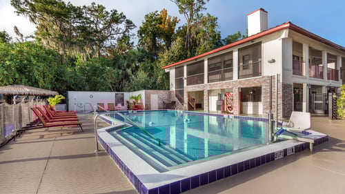 The outdoor pool with seating at Bryan's Spanish Cove.