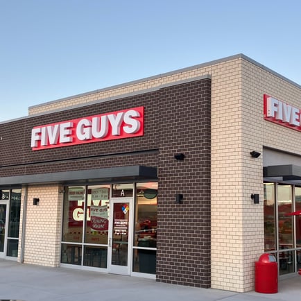 An exterior photograph of the Five Guys restaurant at 6160 Silverstone Drive in Frederick Colorado.