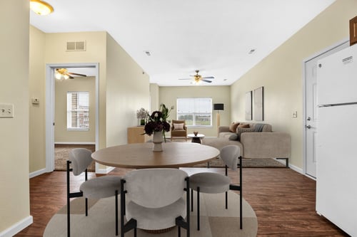 Living room and dining area at Deer Valley Apartments in Silvis, IL 61282