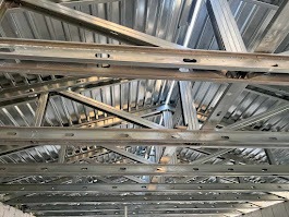 Metal roof deck from Oates Metal Deck used to construct a roofing system.