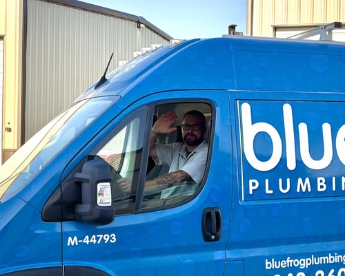 Plumber waiving in van