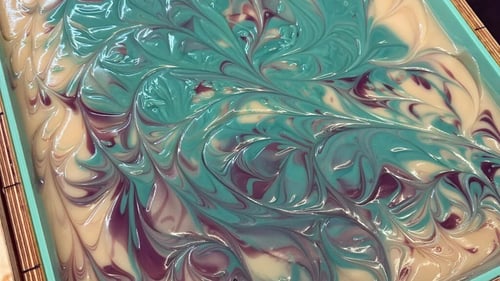 Close up of a multi colored soap being made